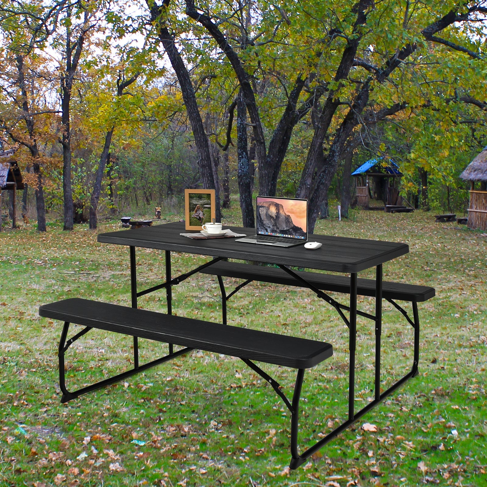 Black Indoor and Outdoor Folding Picnic Table Bench Set with wood-like texture in a garden setting, accommodating four adults.
