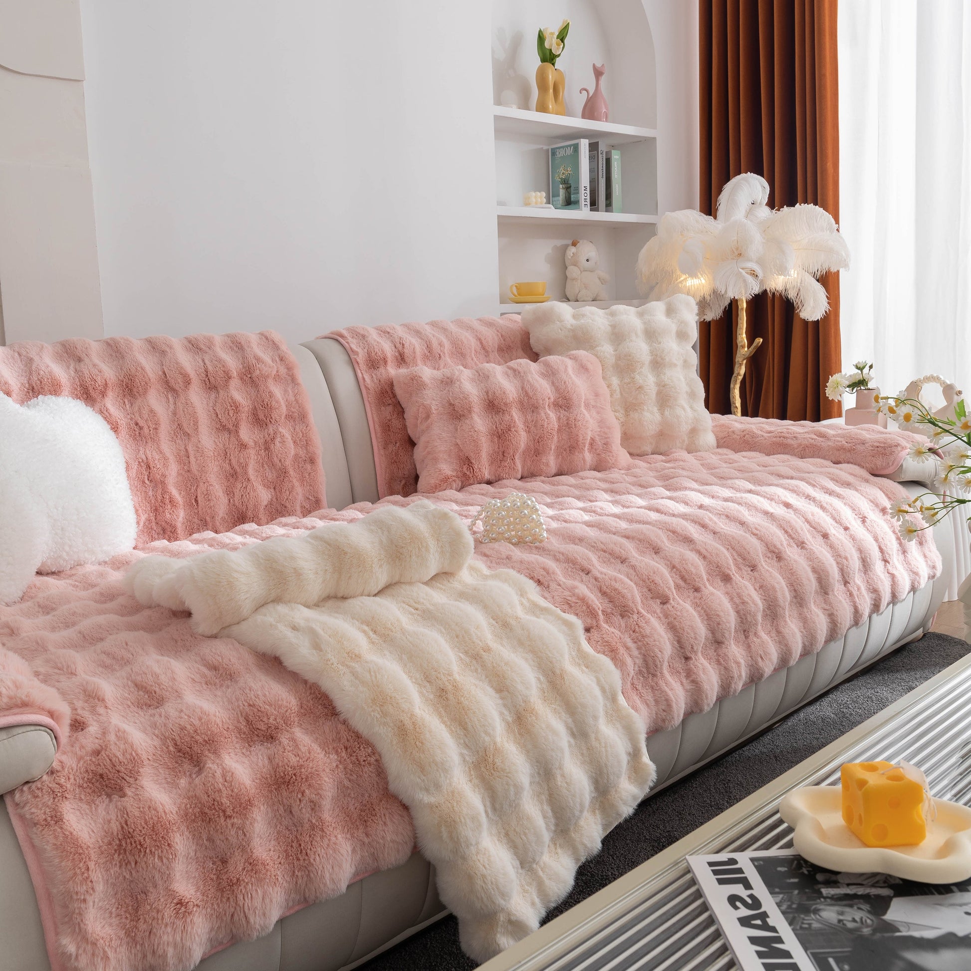 Stylish living room with Thick Sofa Cushion Solid Color Faux Fur Fluffy Sofa Cushion Non-Slip Couch Covers in pink and white.