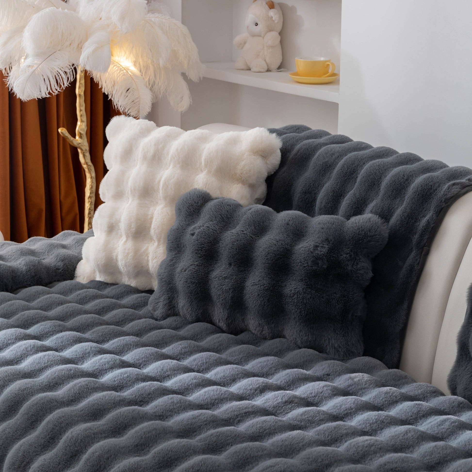 Thick Sofa Cushion Solid Color Faux Fur Fluffy Sofa Cushion Non-Slip Couch Covers on a luxury styled bed with decorative pillows