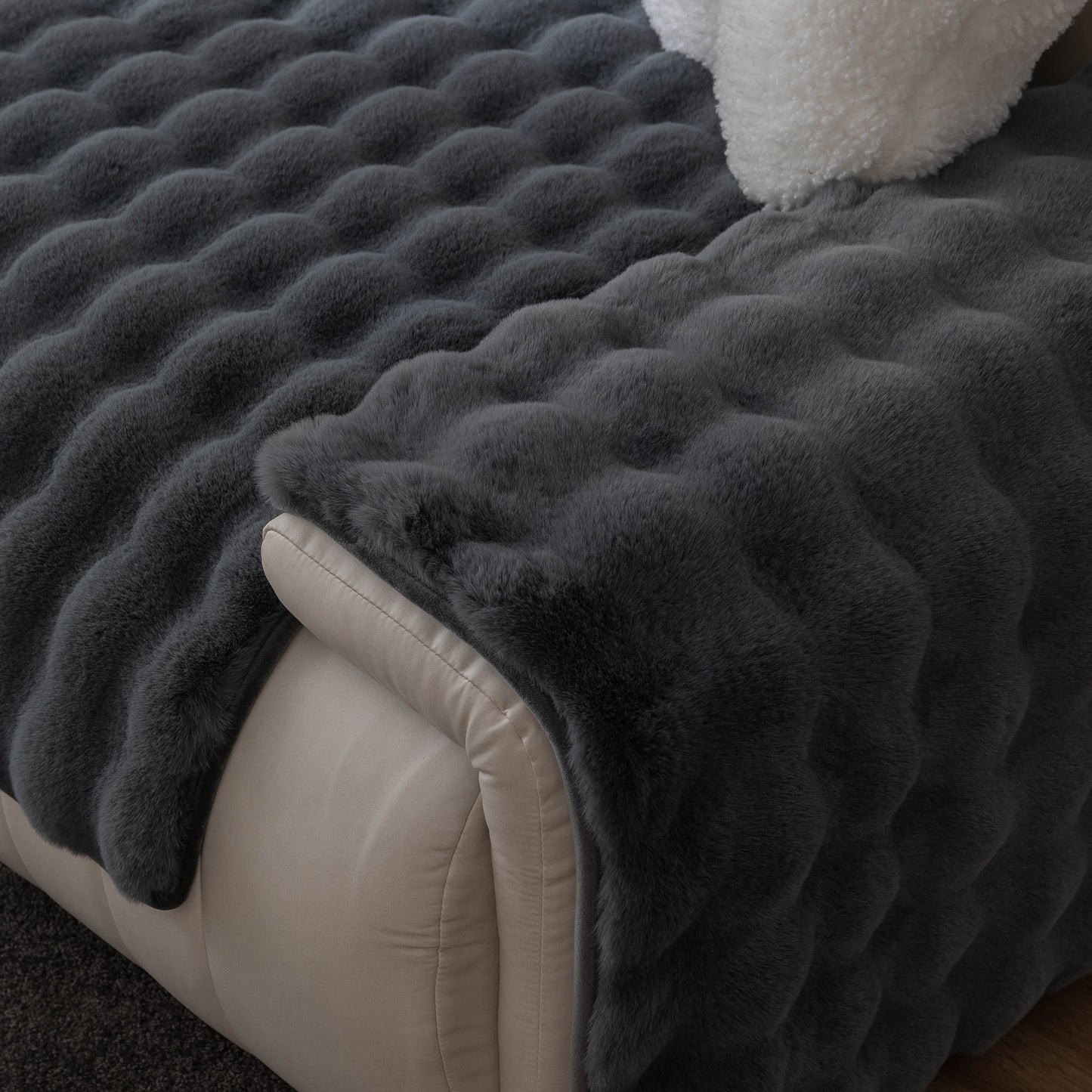 Thick Sofa Cushion Solid Color Faux Fur Fluffy Sofa Cushion Non-Slip Couch Covers in dark gray on a beige sofa