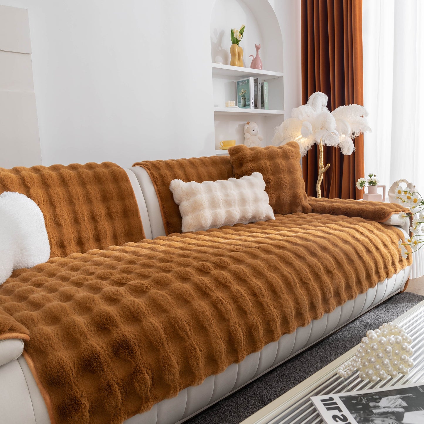 Luxurious living room with a thick sofa cushion solid color faux fur fluffy sofa cushion non-slip couch covers in a warm brown shade.