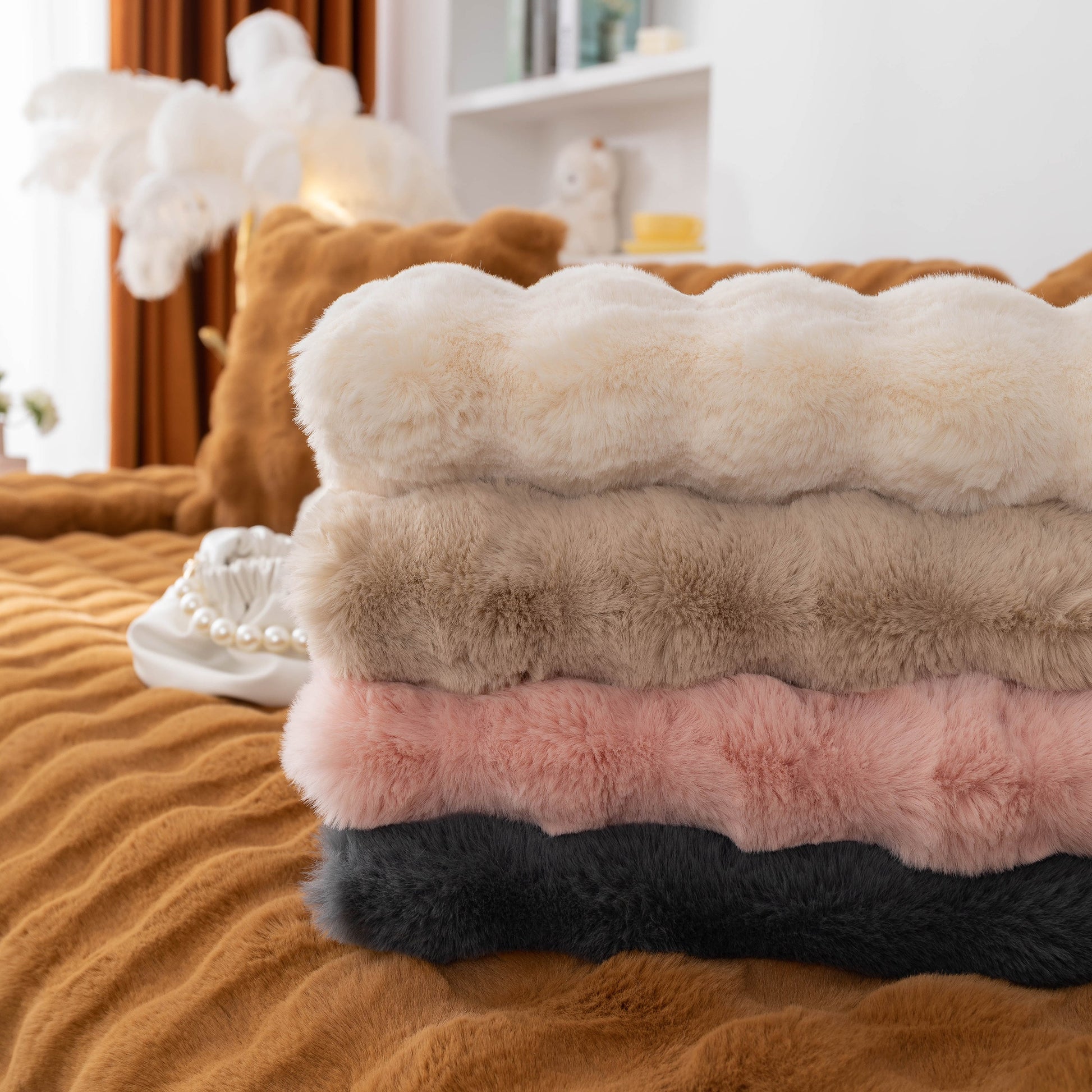 Thick Sofa Cushion Solid Color Faux Fur Fluffy Sofa Cushion Non-Slip Couch Covers in assorted colors stacked on a sofa
