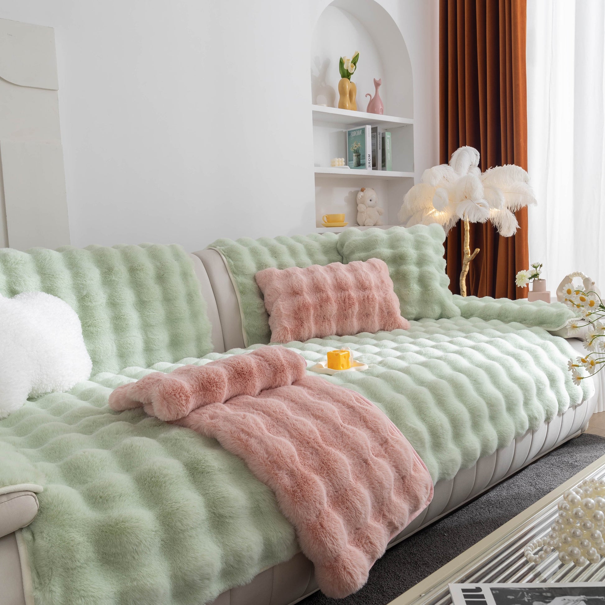 Living room with Thick Sofa Cushion Solid Color Faux Fur Fluffy Sofa Cushion Non-Slip Couch Covers in green and pink on white couch.