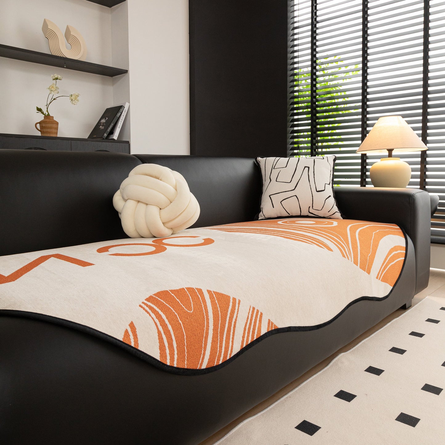 Abstract Art Sofa Cover with Wave Edge, Non Slip Couch Cover for Stylish Homes on black sofa in modern living room.
