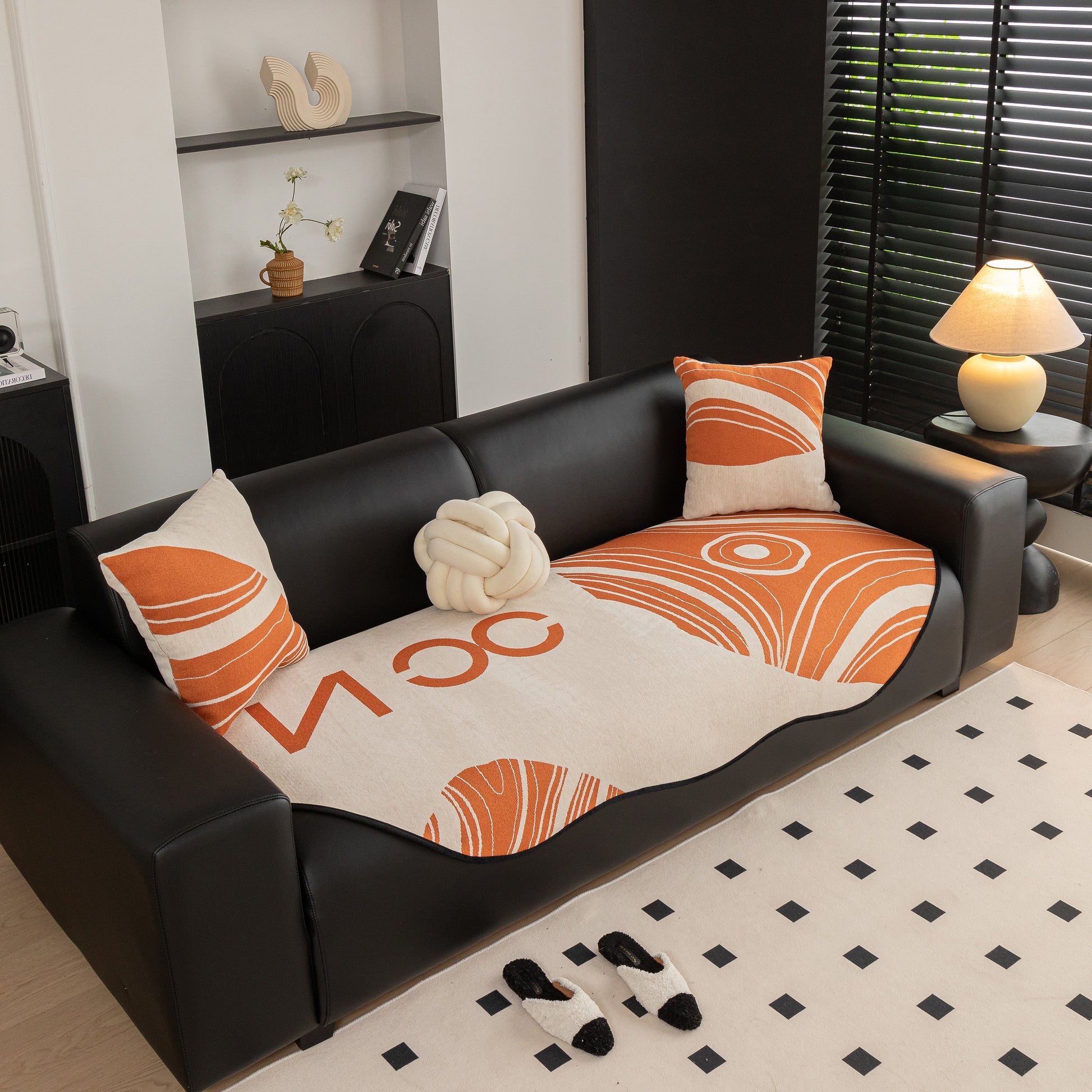 Abstract Art Sofa Cover with Wave Edge, Non Slip Couch Cover for Stylish Homes in modern living room setting with pillows