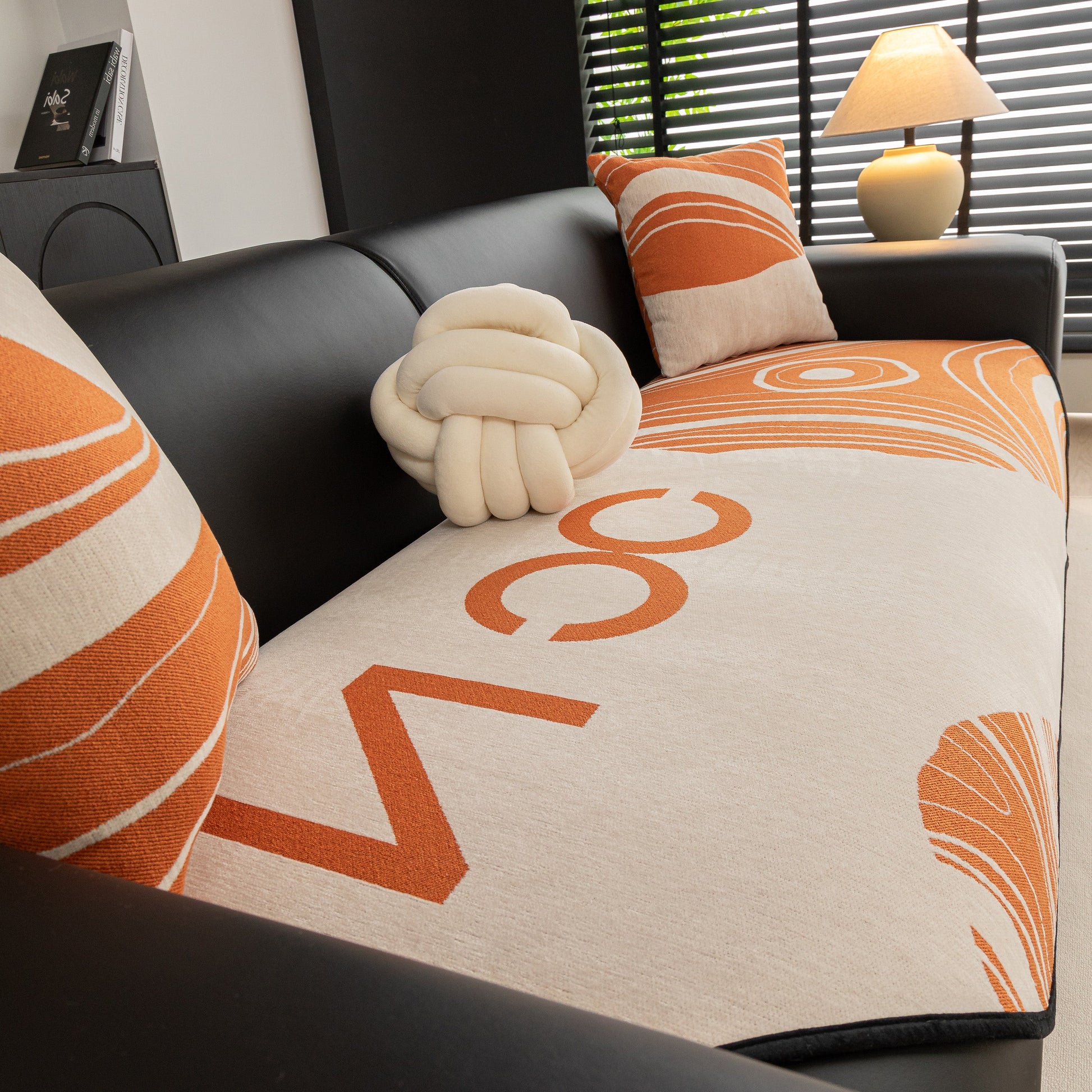 Abstract Art Sofa Cover with Wave Edge, Non Slip Couch Cover for Stylish Homes on modern black sofa with orange pattern