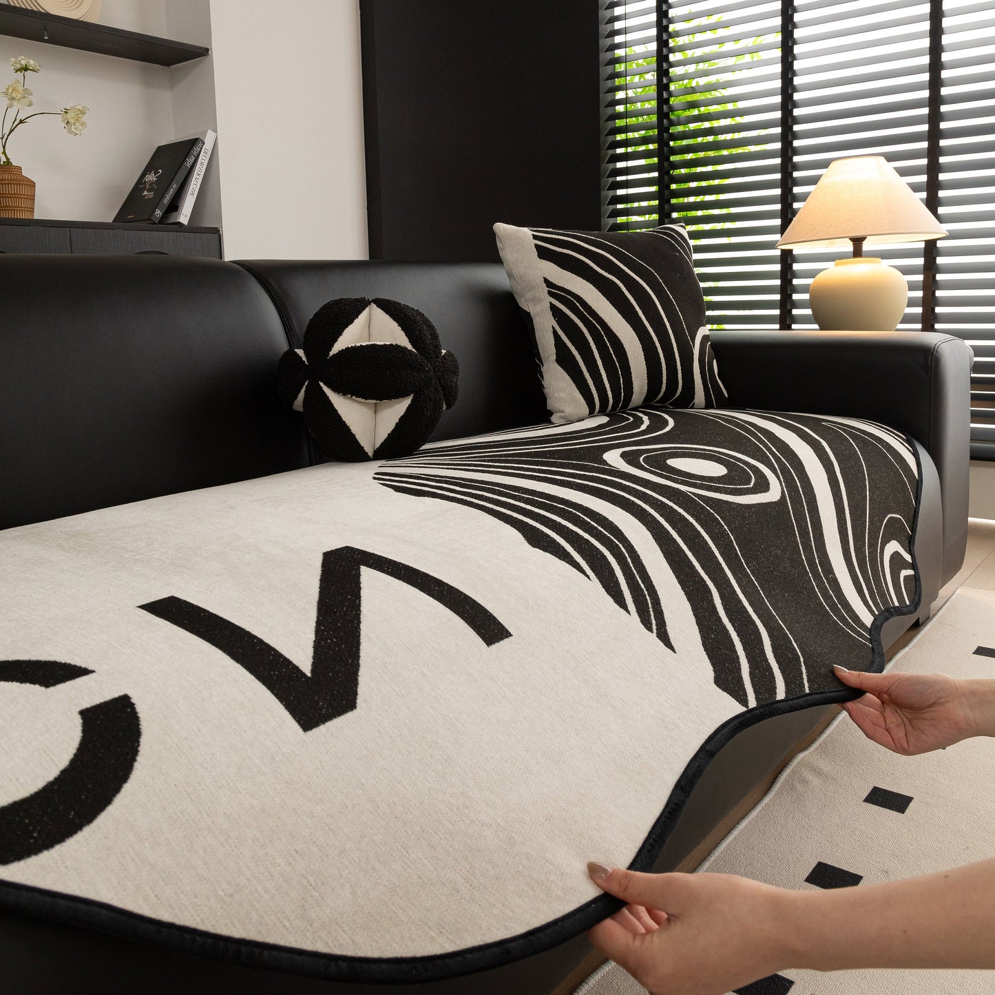 Abstract Art Sofa Cover with Wave Edge, Non Slip Couch Cover for Stylish Homes on a modern living room sofa.