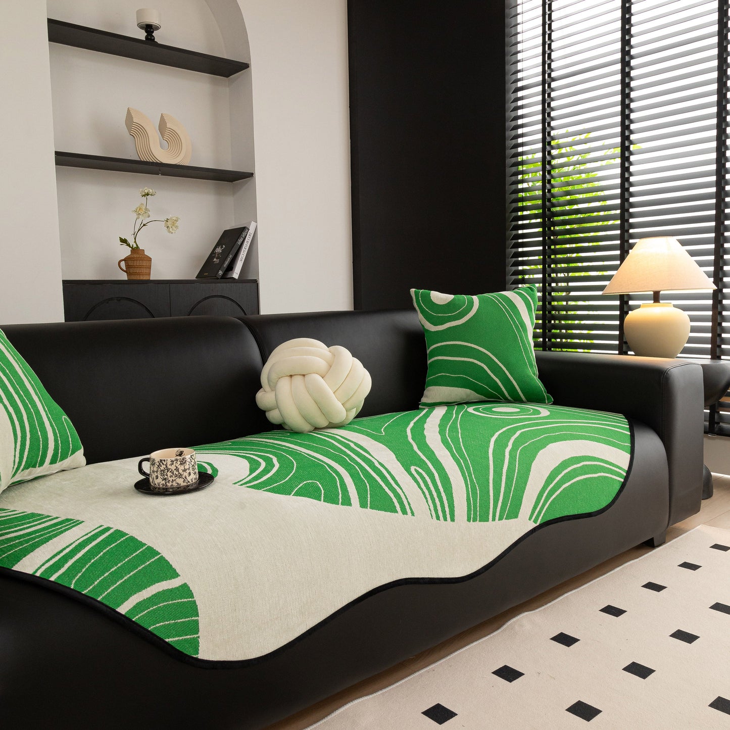 Abstract Art Sofa Cover with Wave Edge, Non Slip Couch Cover for Stylish Homes on a black couch in a modern living room