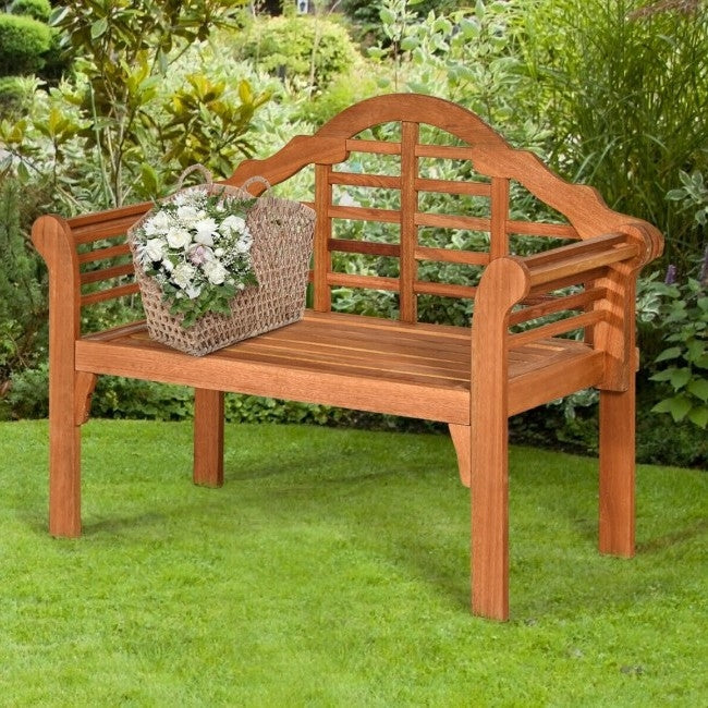 FarmHome Folding 2 Seater Garden Eucalyptus Bench in a lush green garden setting
