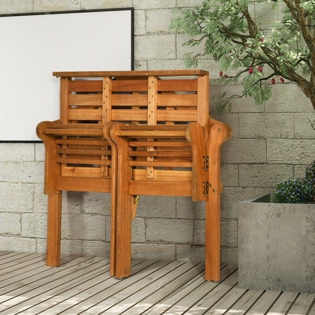 FarmHome Folding 2 Seater Garden Eucalyptus Bench folded against stone wall on wooden deck