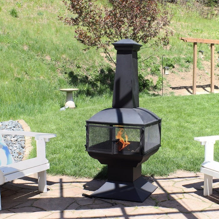 Large Black Outdoor Steel Chimenea Wood Burning Fire Pit on patio with seating