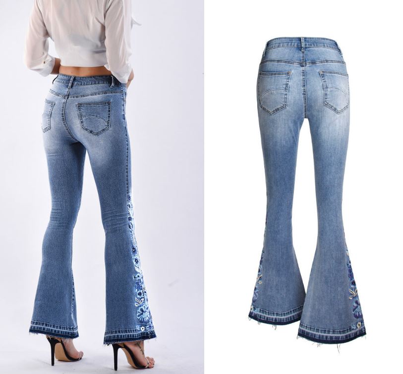 Back view of "Riley" Flared Denim Jeans in light blue with embroidered details, mid-waist fit, and retro street hipster style.