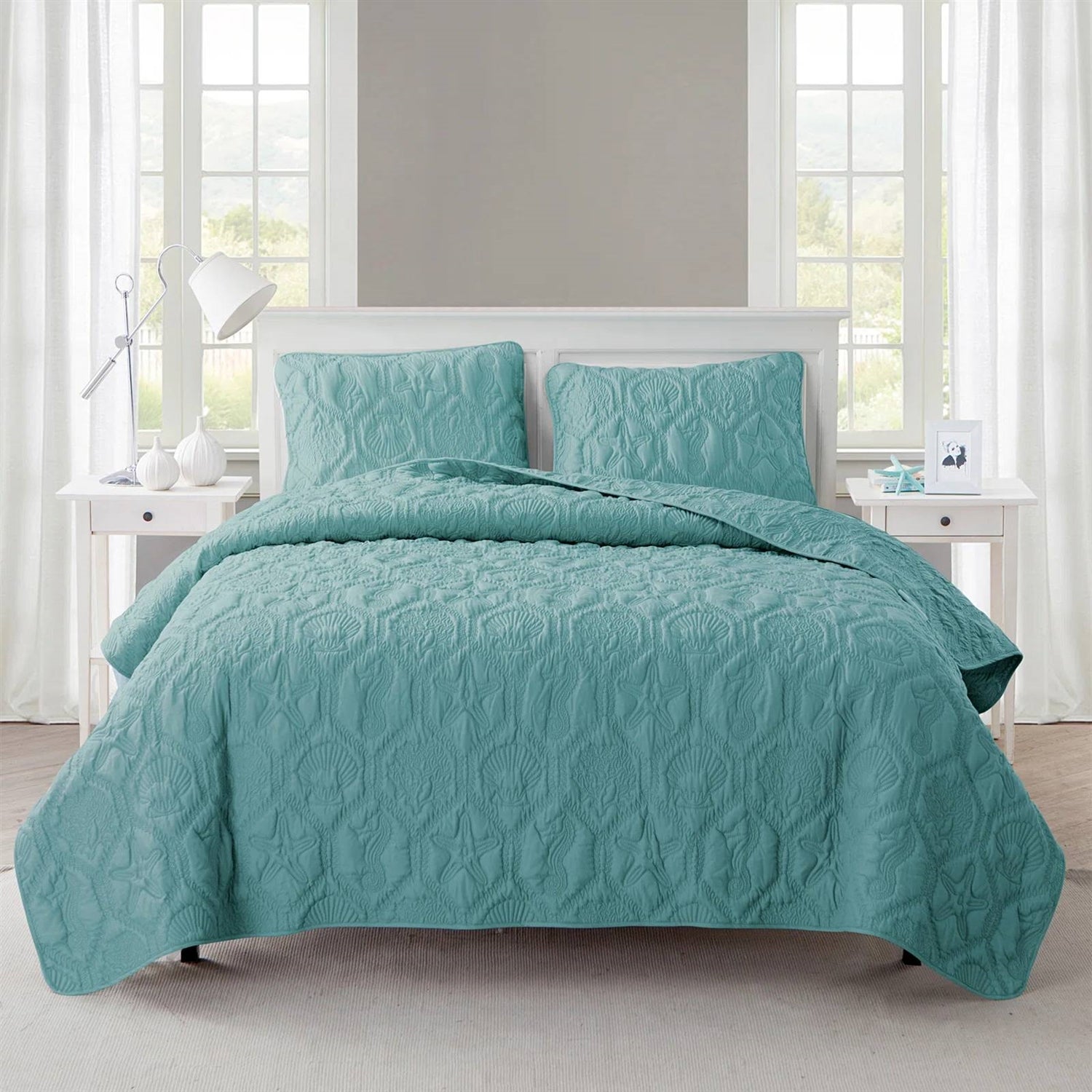 King Coastal Beach Starfish Seashell Seahorse Aqua Blue Teal 3-Piece Quilt Set on bed with white decor in bright room