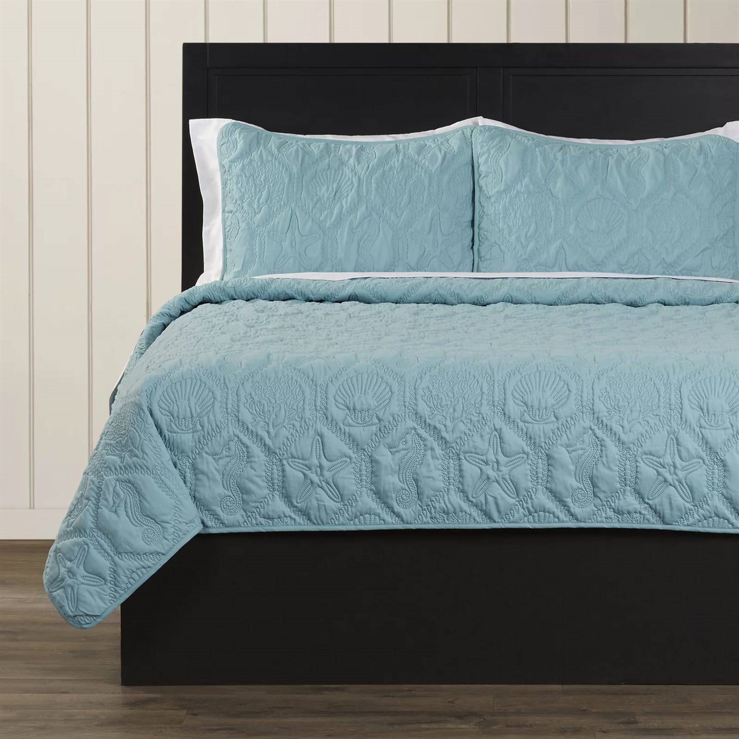 King Coastal Beach Starfish Seashell Seahorse Aqua Blue Teal 3-Piece Quilt Set with embossed sea life pattern on bed.