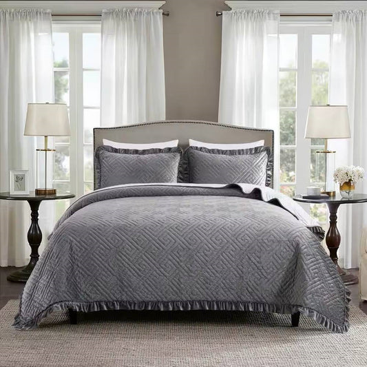 Bedroom with King Gray Charcoal Velvet Microfiber Polyester Reversible 3-Piece Quilt Set on bed, elegant decor with lamps and curtains.