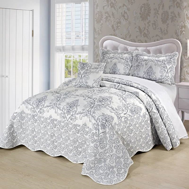 King size White Damask Embroidered 4 Piece Oversized Bedspread Set displayed on a bed in an elegant bedroom setting.