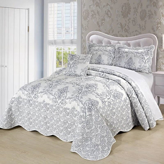 King size White Damask Embroidered 4 Piece Oversized Bedspread Set displayed on a bed in an elegant bedroom setting.