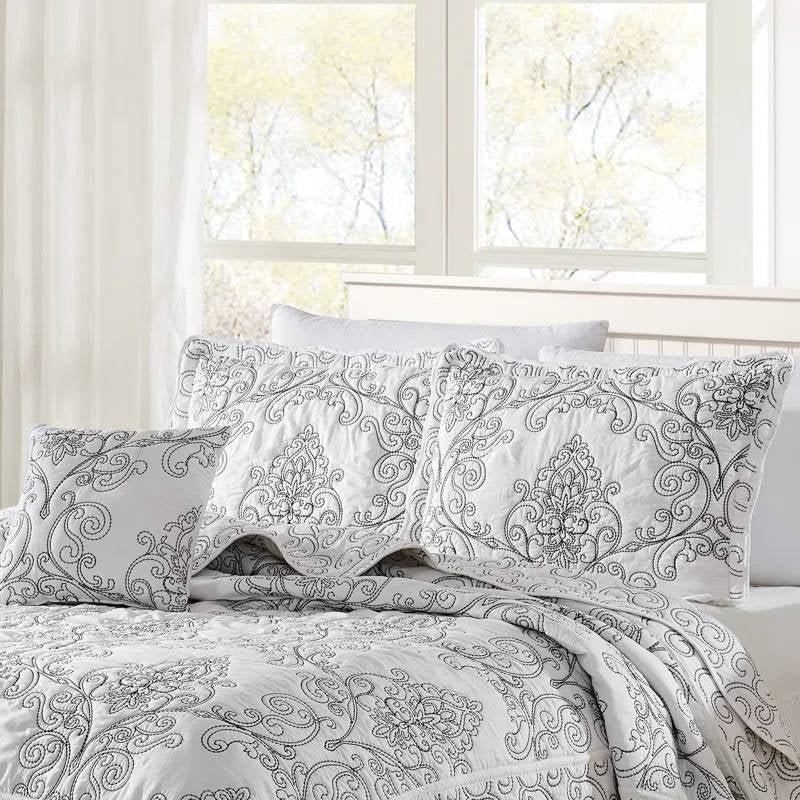 King size White Damask Embroidered 4 Piece Oversized Bedspread Set on a neatly made bed in a bright bedroom