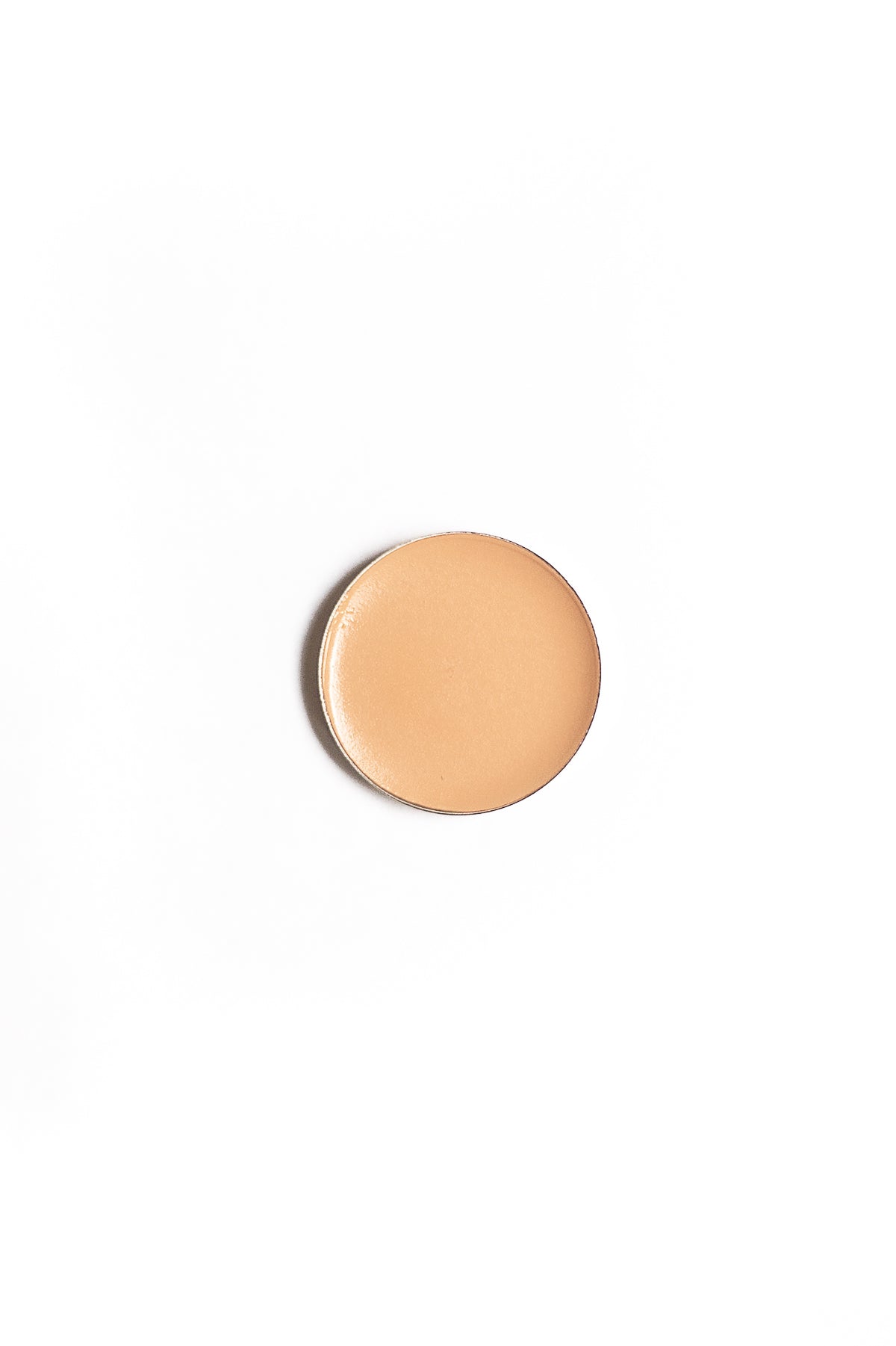 Brow Sculpting Creme Refill in a circular pan, ideal for shaping and defining eyebrows with a creamy, long-wearing formula.