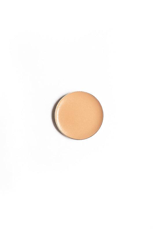 Brow Sculpting Creme Refill in a circular pan, ideal for shaping and defining eyebrows with a creamy, long-wearing formula.