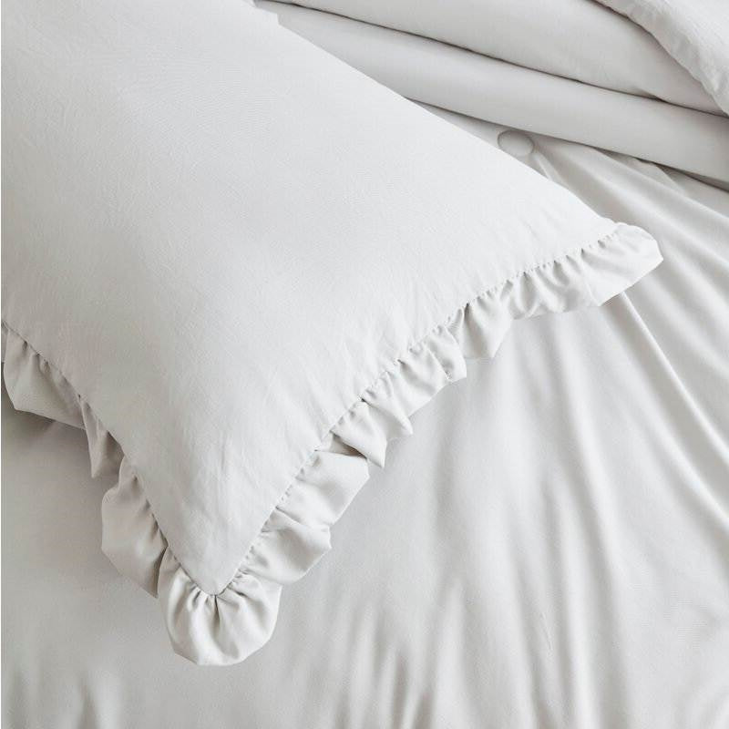Queen Oversized Grey Ruffled Edge Microfiber Comforter Set featuring elegant pillow with ruffled edge in stone washed grey.