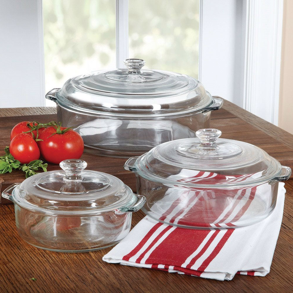6-Piece Round Glass Casserole Cookware Bakeware Set with Lids on kitchen table with fresh tomatoes and red striped towel.