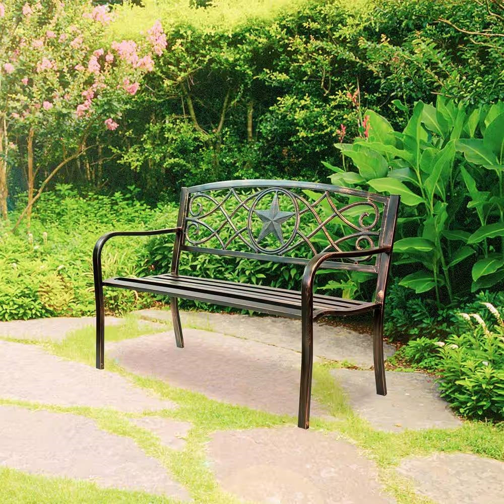 Powder Coated Steel 4-ft. Outdoor Patio Garden Bench in Bronze Metal Finish with lone star design on a garden path