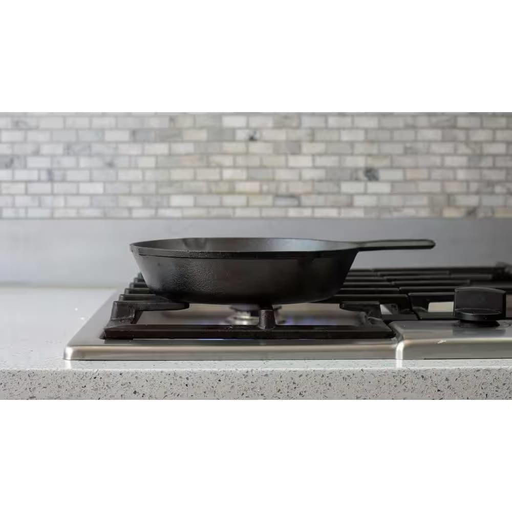 12-inch Cast Iron Skillet Frying Pan with Pour Spout - Made in the USA on stovetop