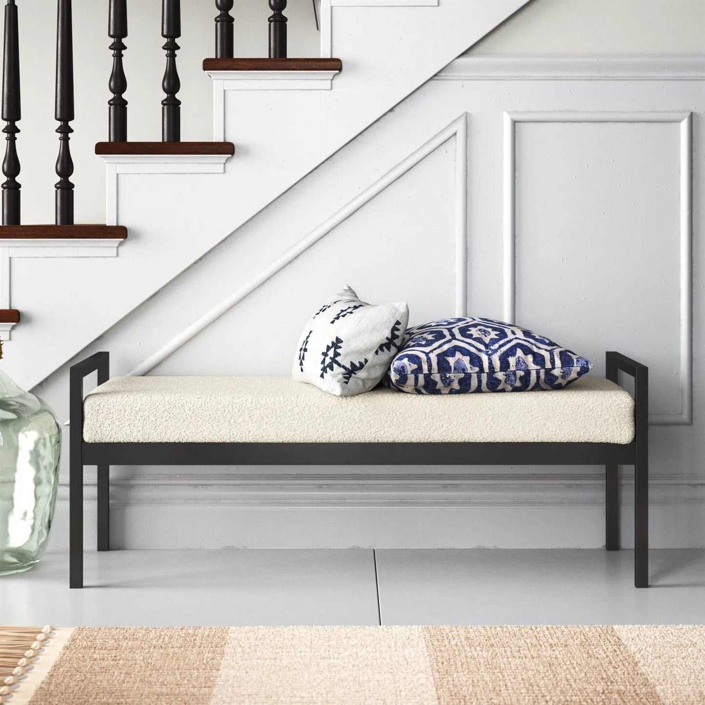 Modern Industrial Bed Bench with Black Metal Frame and Cream Upholstered Cushion in a stylish entryway setting