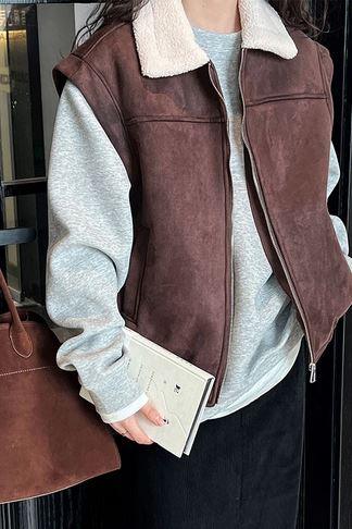 Woman wearing the Desert Breeze Sleeveless Lambs Wool Vest for Cowgirl Style - Warm & Stylish, highlighting suede velvet and lamb's wool finish.
