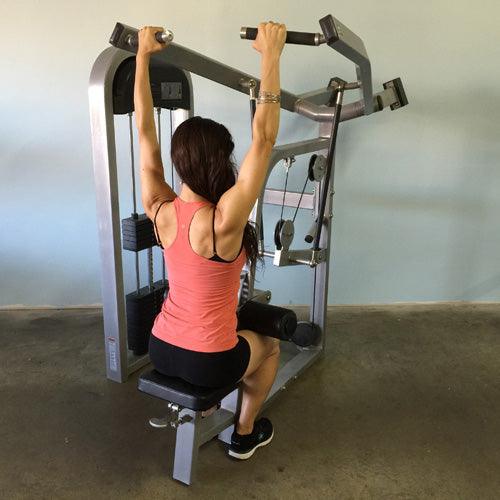 Woman performing lat pulldown exercise on Muscle D Fitness Classic Lat Pulldown Machine