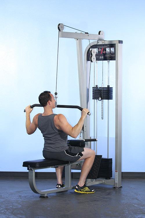 Person performing lat pulldown on Muscle D Fitness Dual Function Lat Low Row Machine seated