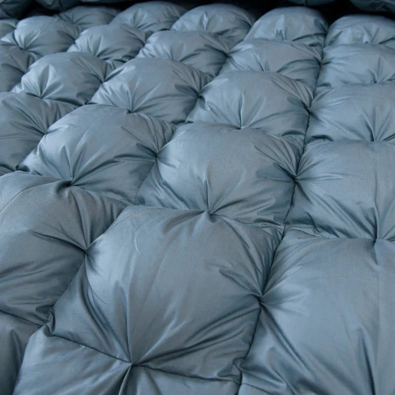 Close-up of Giuseppina 1000 Thread Count Goose Down Comforter Duvet showing textured quilted design and soft Egyptian cotton