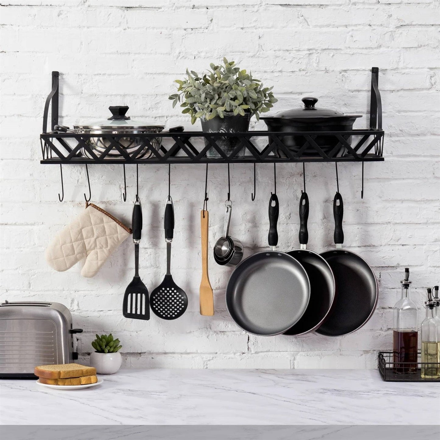 Black Metal Rectangular Wall Mounted Kitchen Pot Rack with 12 Hanging Hooks displaying pans, utensils, and kitchenware.