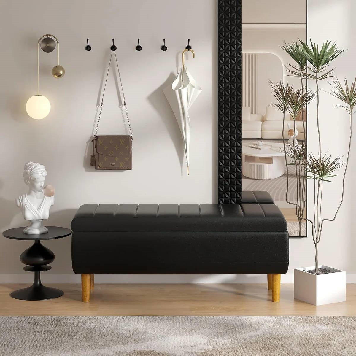 Modern Mid-Century Black Faux Leather End of Bed Storage Bench Ottoman in stylish room setting