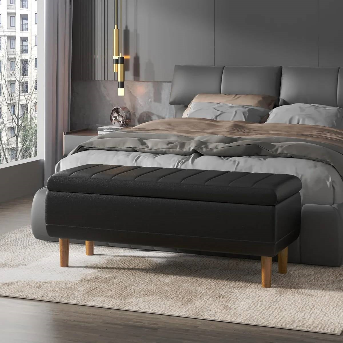 Modern Mid-Century Black Faux Leather End of Bed Storage Bench Ottoman in bedroom setting