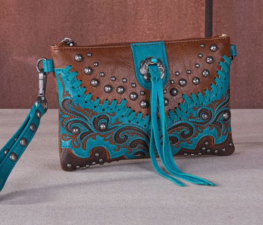 Tassel Western Clutch & Crossbody Bag with turquoise tassels, embroidered scroll design, whipstitch edges, and silver studs