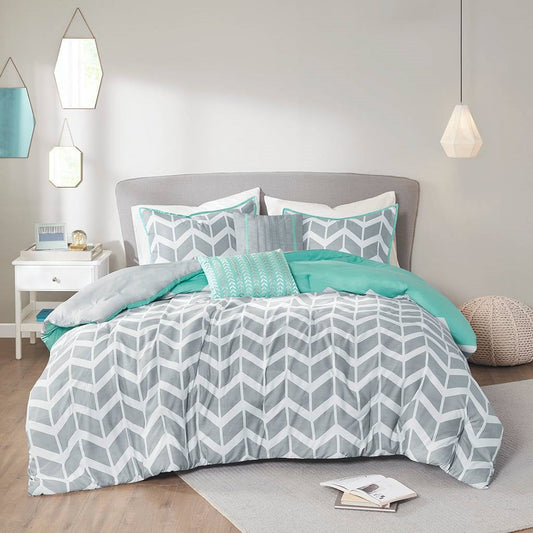 Twin/Twin XL Reversible Comforter Set in Grey White Aqua Teal Chevron Stripe on a modern bed with pillows and chevron design.