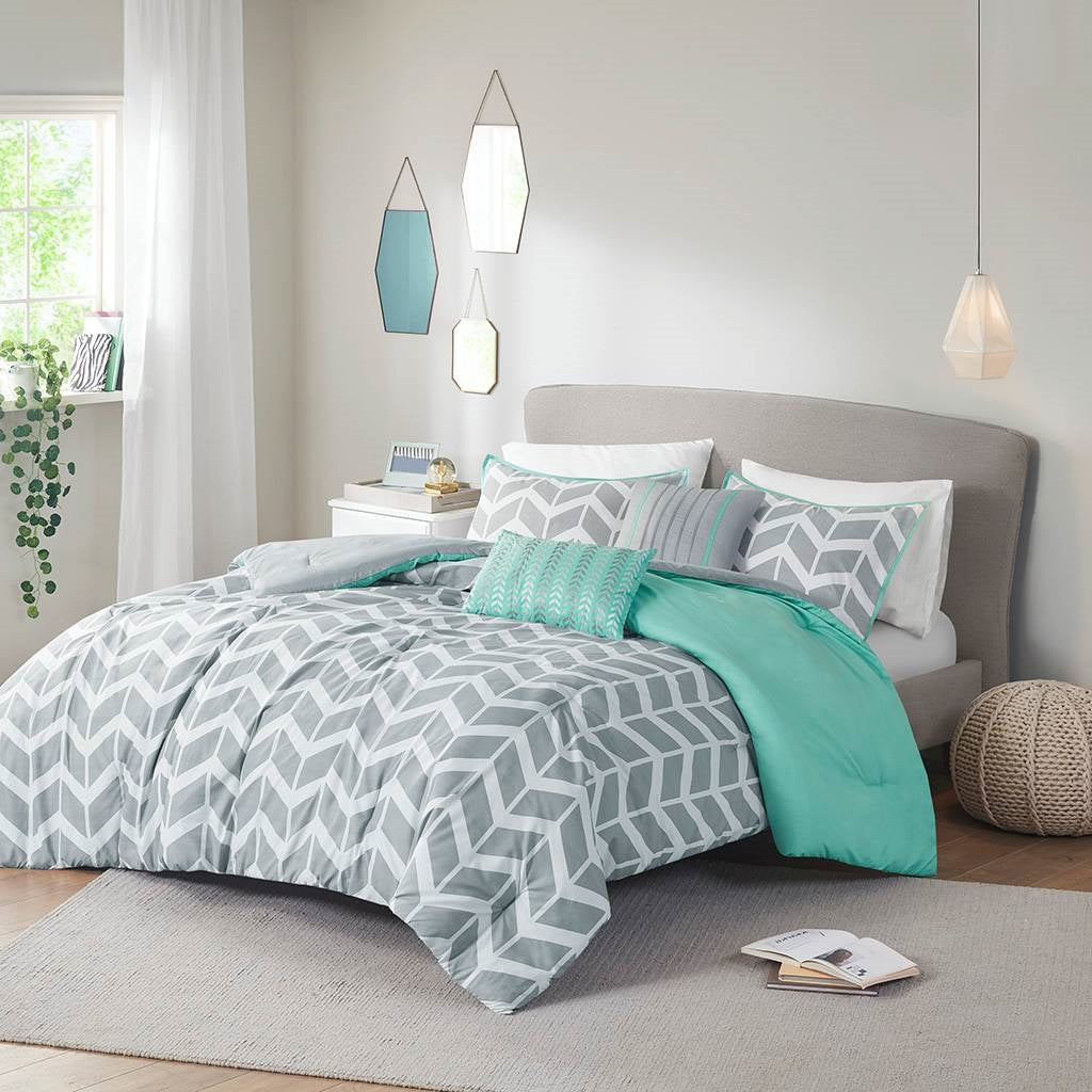 Twin/Twin XL Reversible Comforter Set in Grey White Aqua Teal Chevron Stripe on a modern bed.