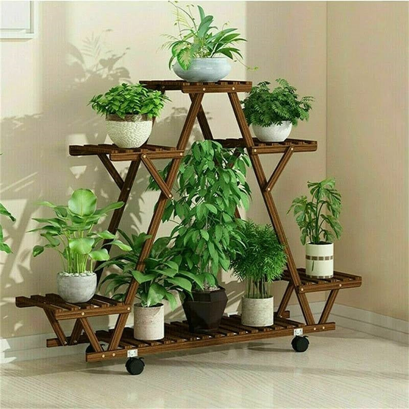 Indoor Outdoor Solid Wood Triangular Multi-Tier Plant Stand with Locking Wheels displaying six potted plants indoors.