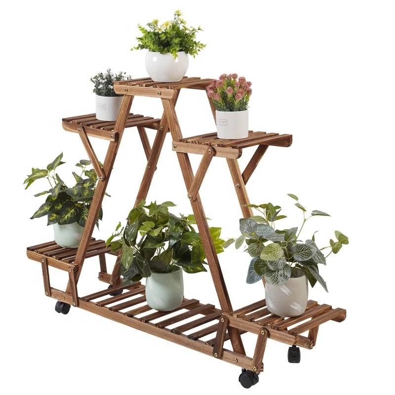 Indoor Outdoor Solid Wood Triangular Multi-Tier Plant Stand with Locking Wheels, holding various potted plants.