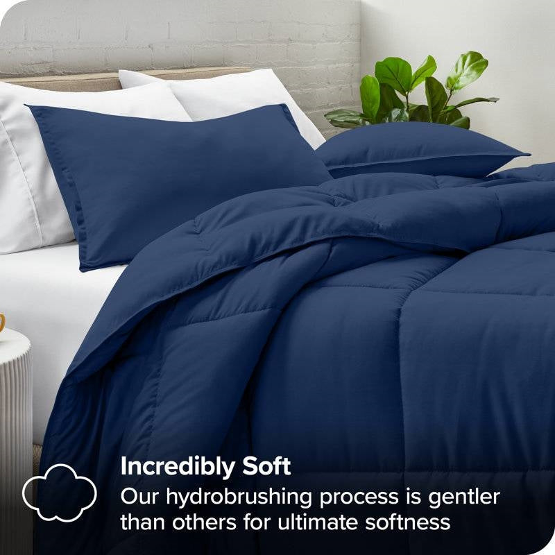 Full/Double size Super Soft Down Alternative Comforter Set in Navy Blue displayed on a bed, showcasing its softness and luxurious texture.