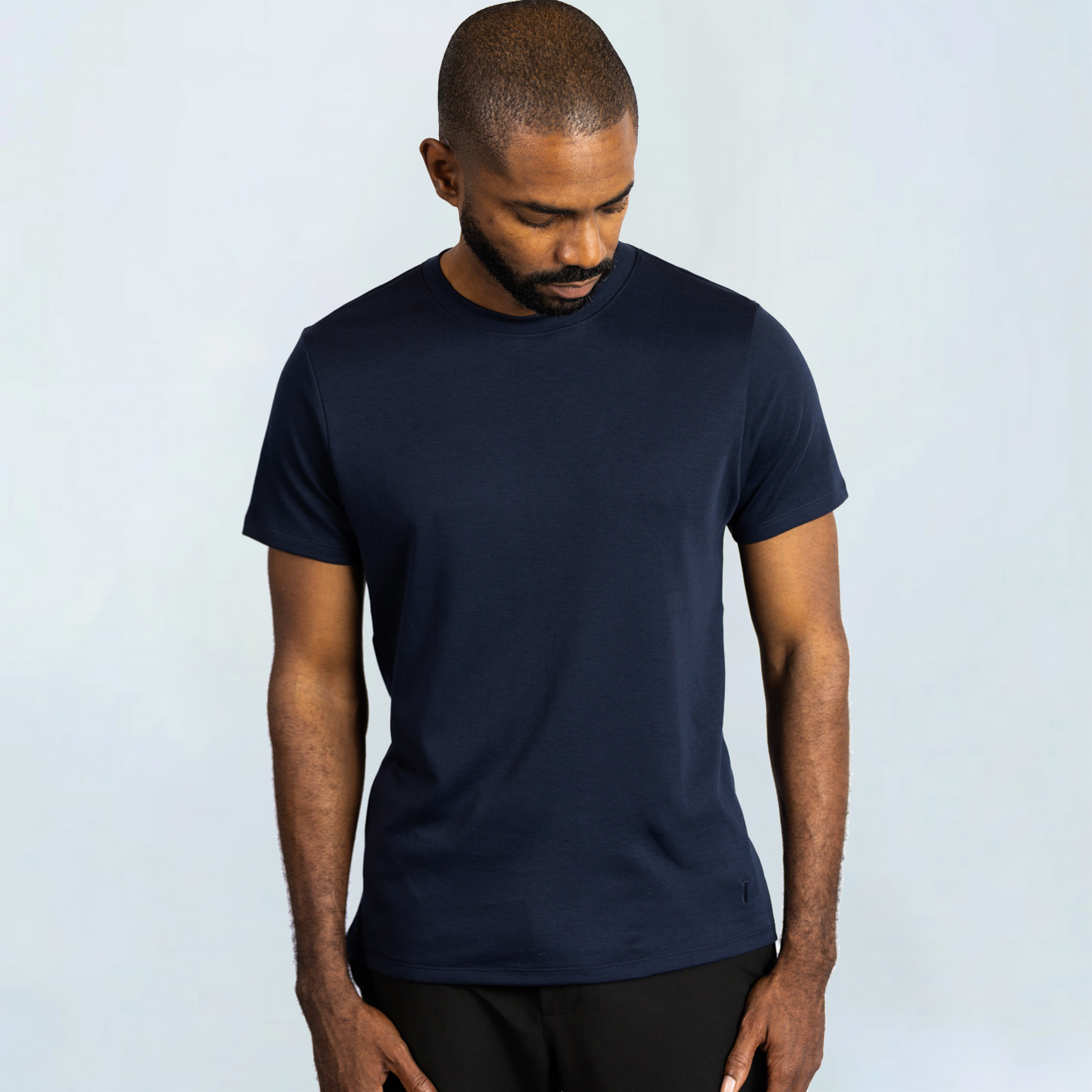 Man wearing BAOBAB Short Sleeve Perfect Tee made from soft Peruvian Pima cotton, showcasing comfort and style in wrinkle-resistant fabric.