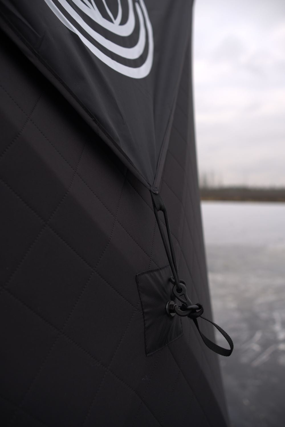 Close-up of Nova 6 Sauna Tent Rain Cover with elastic bands fastened, showing durable and protective features.