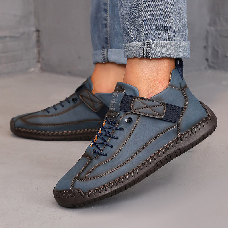Stylish denim blue high-top sneakers with dark stitching details and comfortable rubber soles