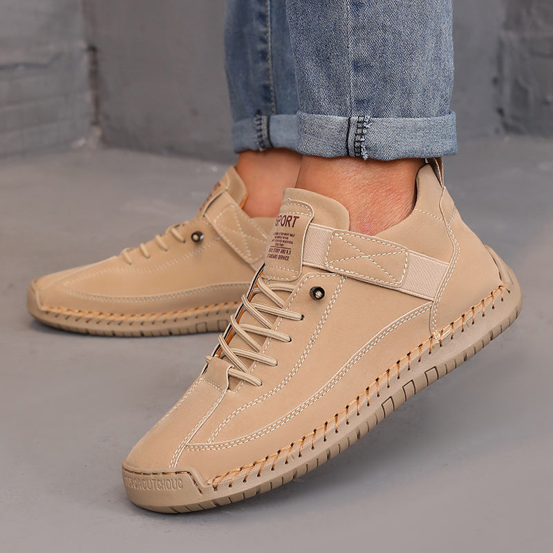 Men's beige leather casual shoes with a sporty design and stitched detailing, perfect for everyday wear and style.