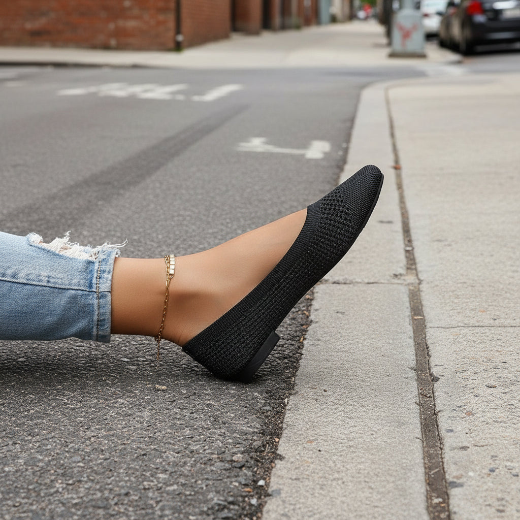 Black Flying Woven Mesh Shallow-Mouth Women’s Shoes worn outdoors showcasing style and comfort.