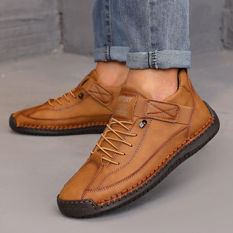 Men's stylish leather sport shoes with tan color, lace-up design, and black rubber soles for casual and sporty outfits.