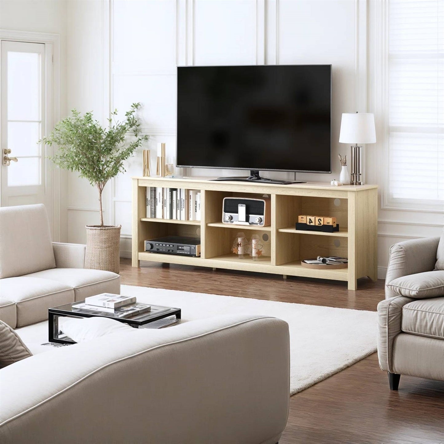 Farmhouse TV Stand in Light Oak Wood Finish - for TVs up to 70-inch in a living room with open compartments and decor displayed.