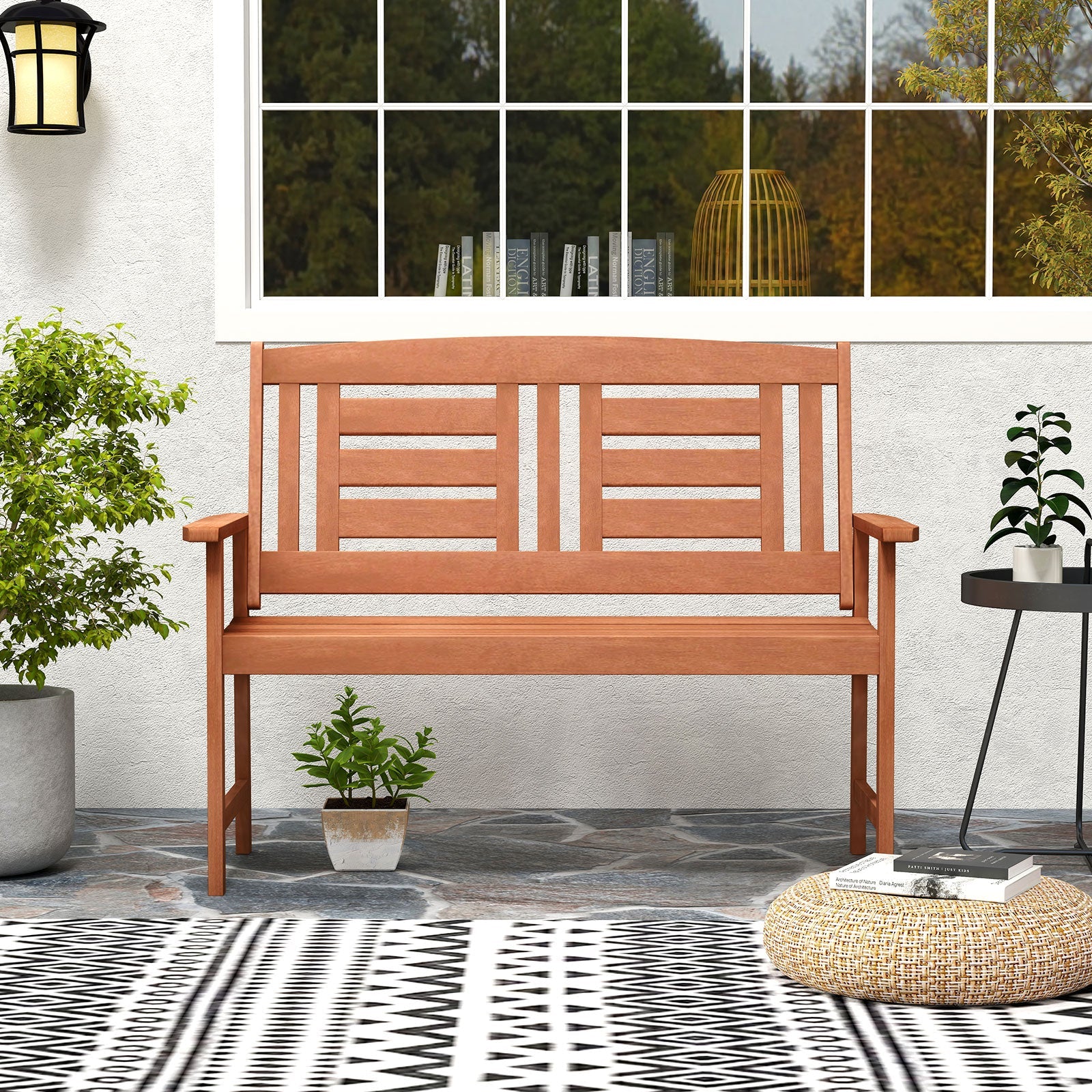 Outdoor Solid Wood Loveseat Hardwood 2-Seat Bench with Inclined Backrest and Slatted Seat on patio with plants